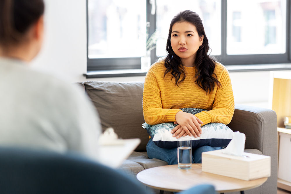 woman in individual therapy sitting on couch