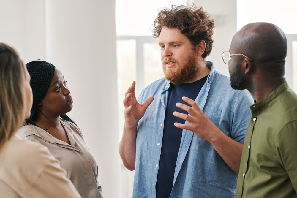 man talking to recovery group