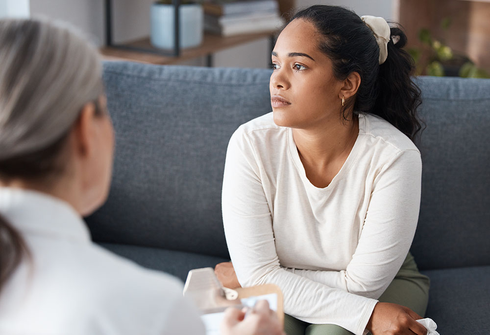 Thinking psychologist, therapy and woman in consultation for mental health on sofa. Therapist, psychology and female patient consulting, counseling and discussion for depression, memory and problem. struggling with substance use